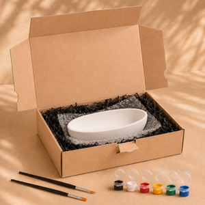 Lieferumfang der ovalen Dekoschale zum Bemalen mit Farben, Pinseln und Verpackung