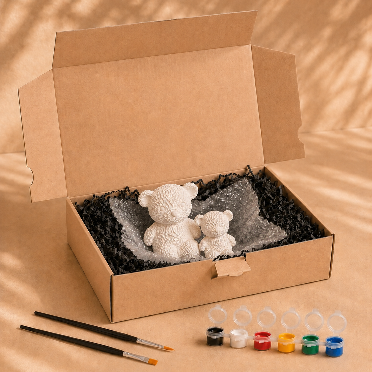 Lieferumfang des Teddy-Sets zum Bemalen mit Farben, Pinseln und Verpackung